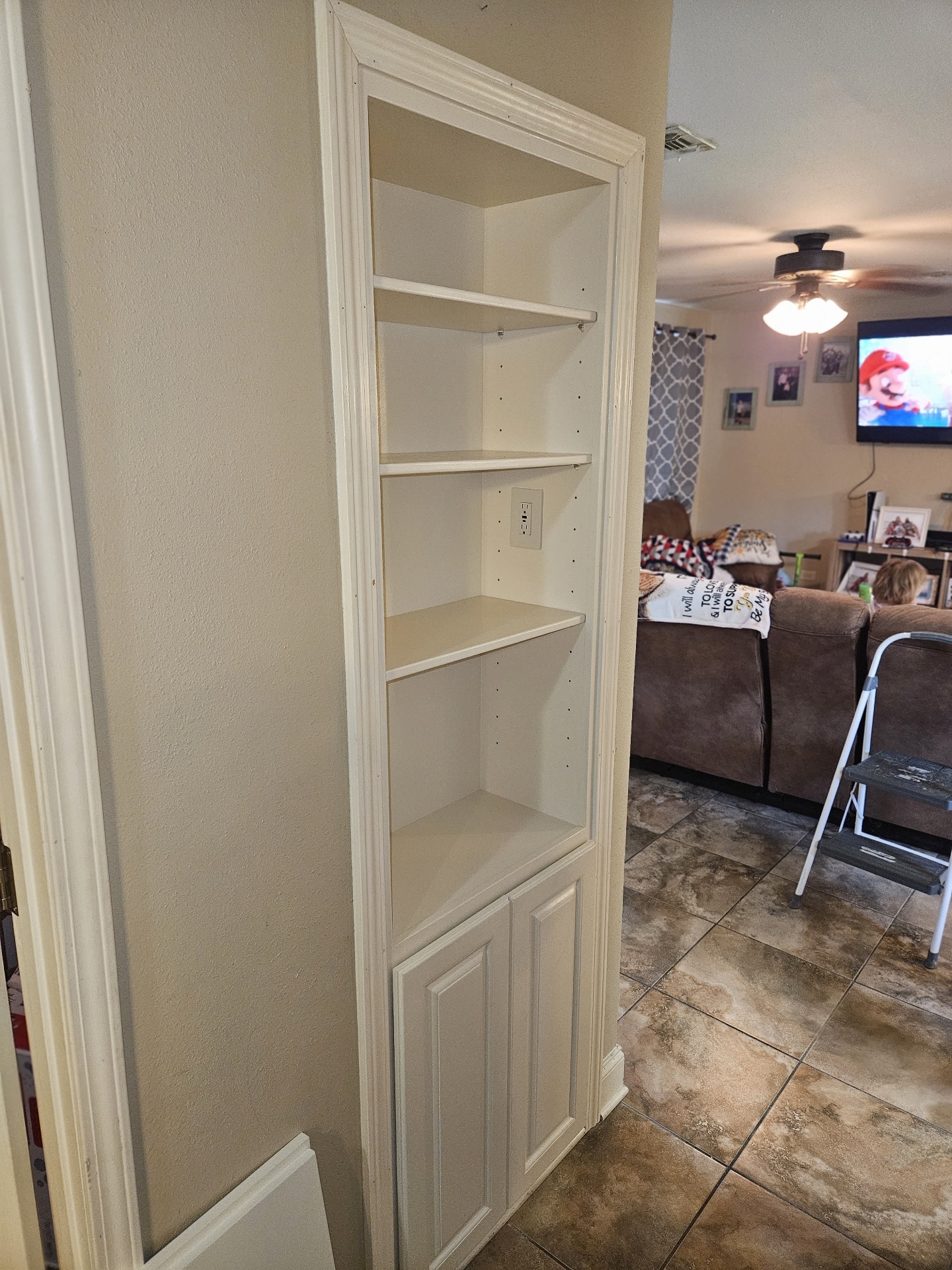 Finished built-in painted white with shelves removed for install