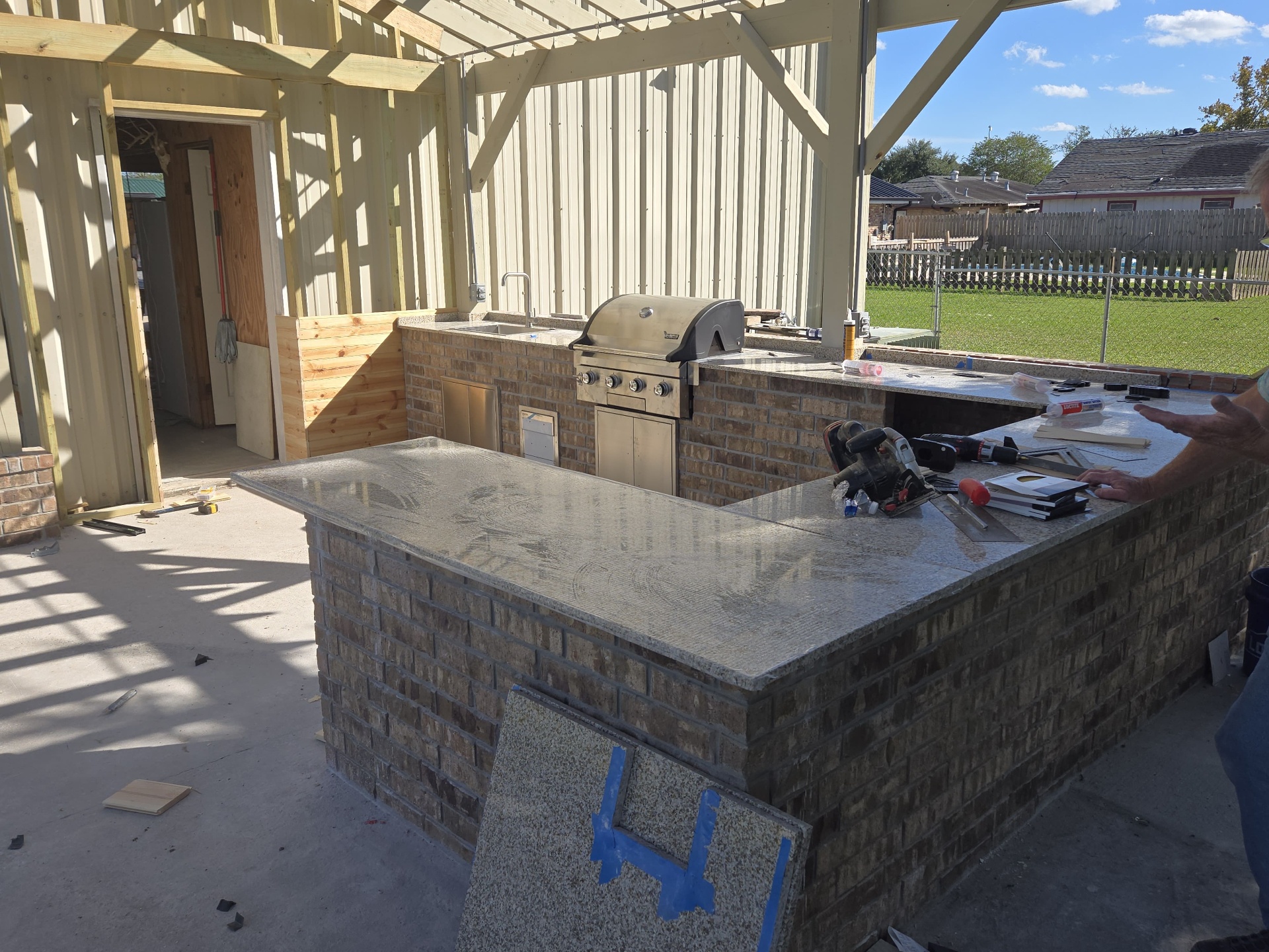 Granite countertops installed with stainless grill and sink in place