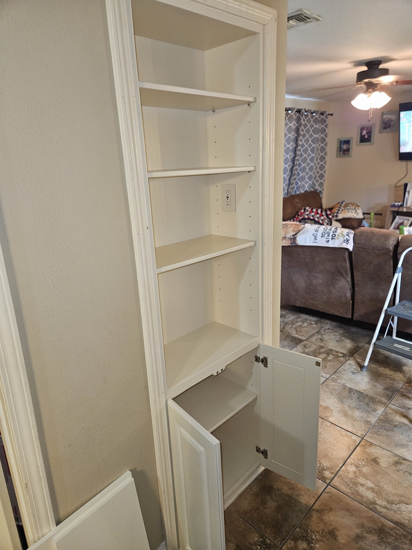 Lower cabinet door hinged in place during final assembly