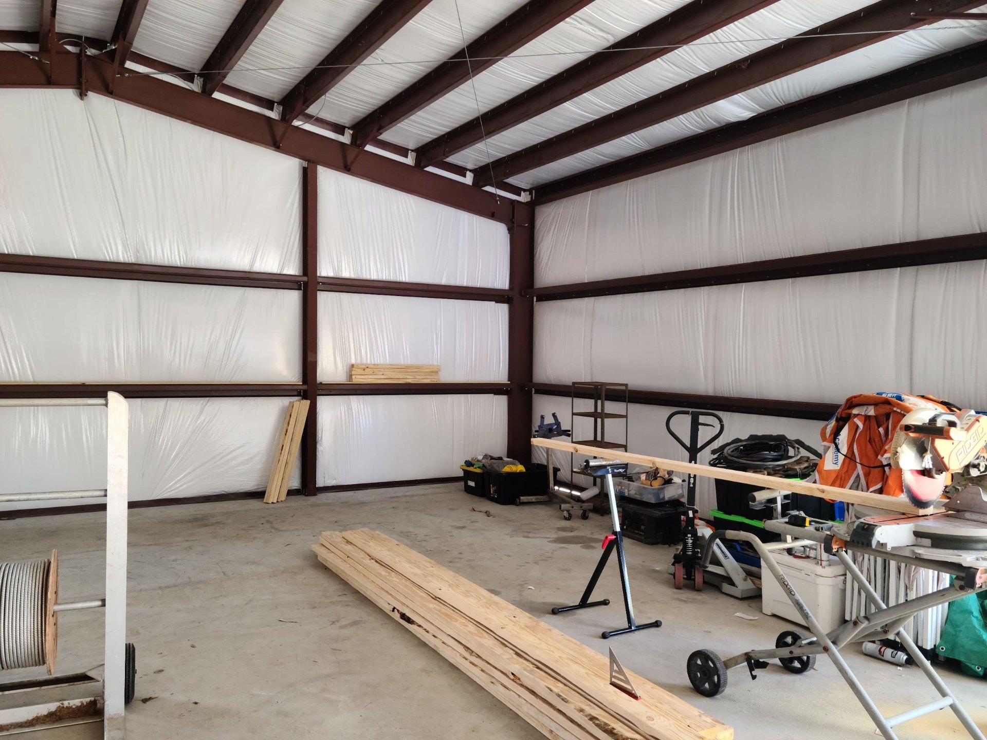 Insulated walls and clean concrete floor of the working shop