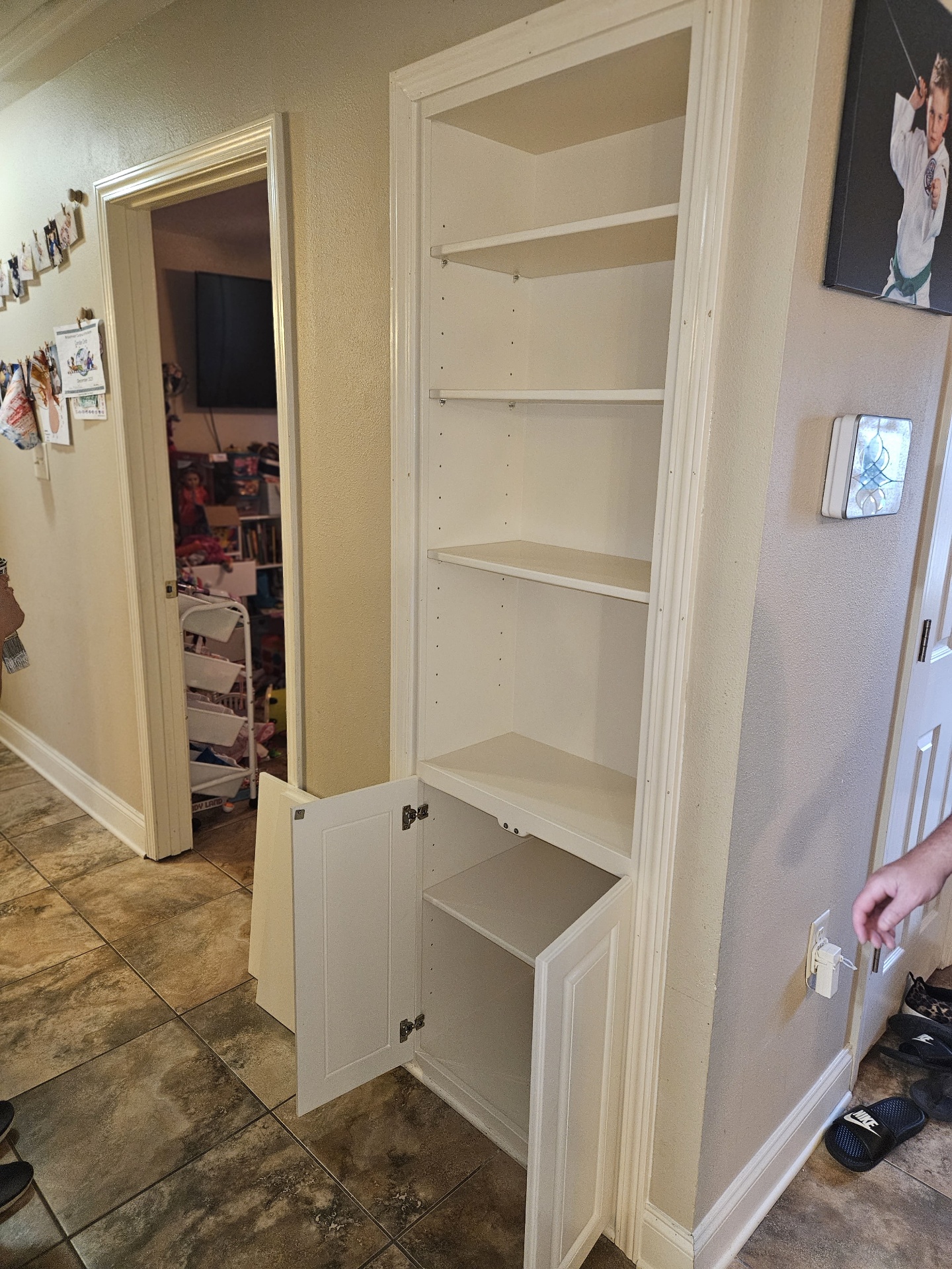 Installed built-in shelf with the lower cabinet door open