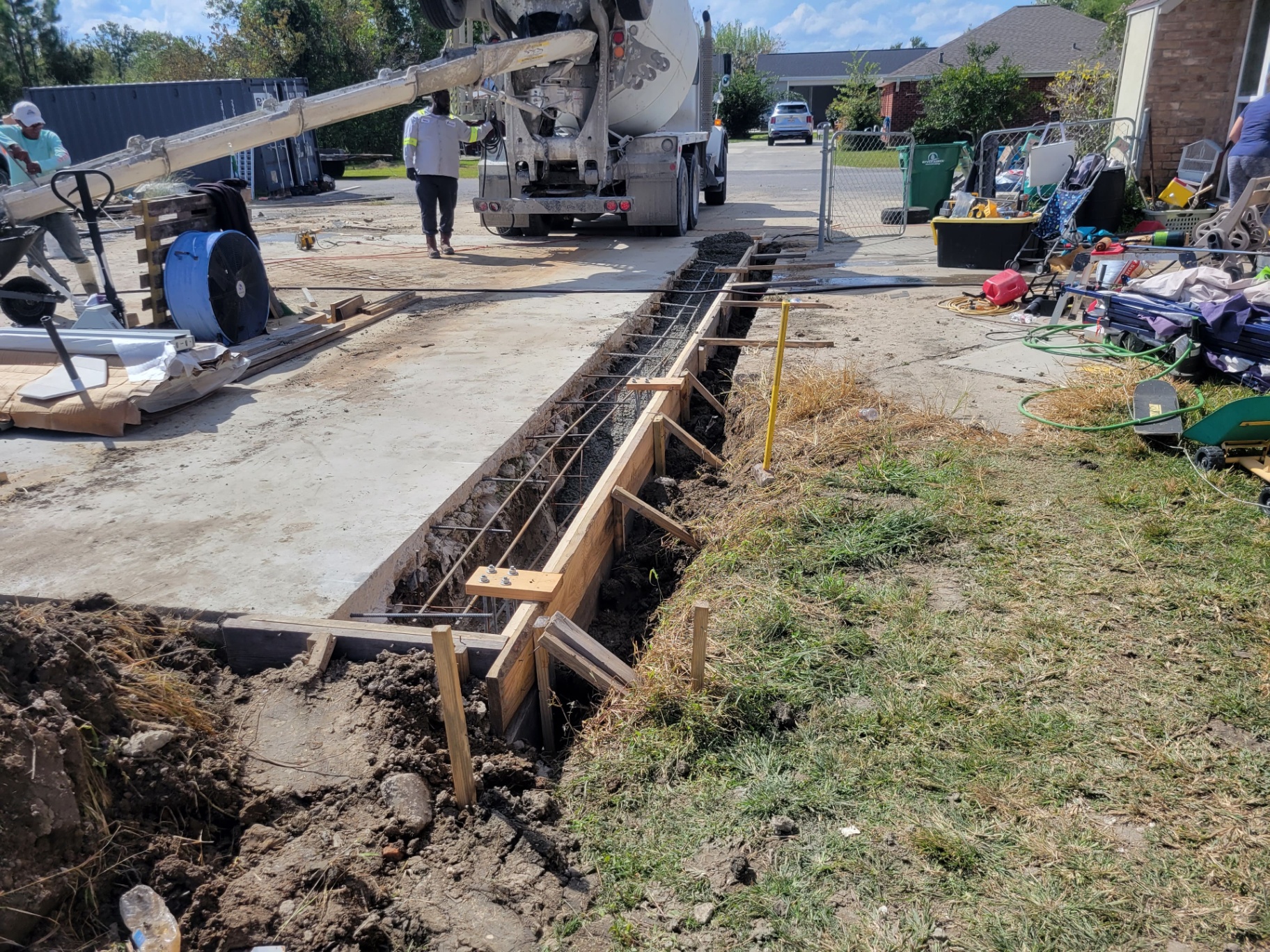 Concrete pump truck pouring a new reinforced footing