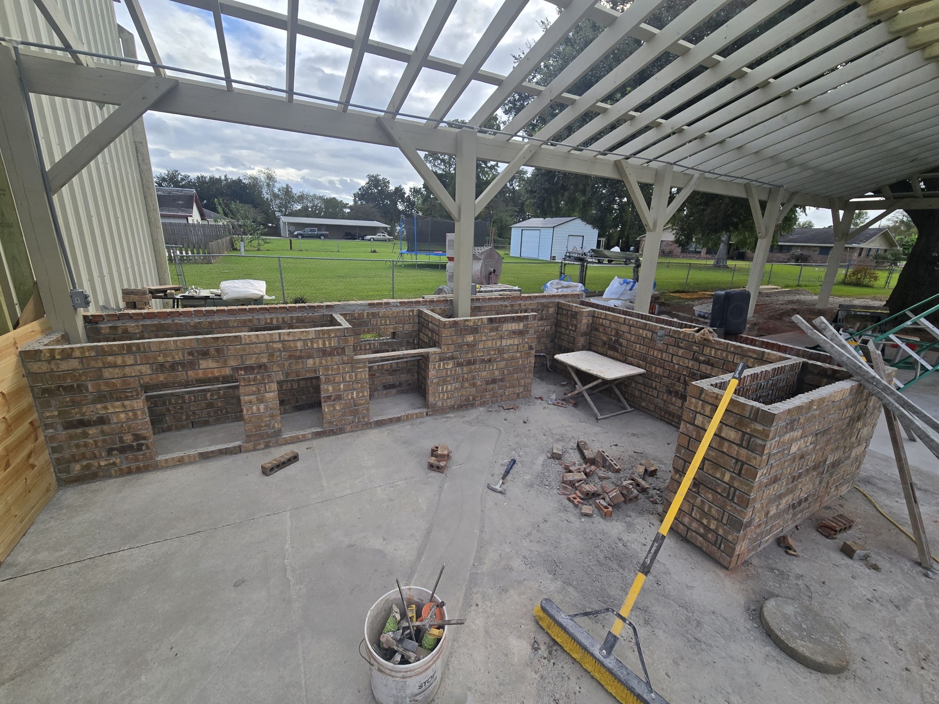 Brick walls and bar layout of the outdoor kitchen taking shape