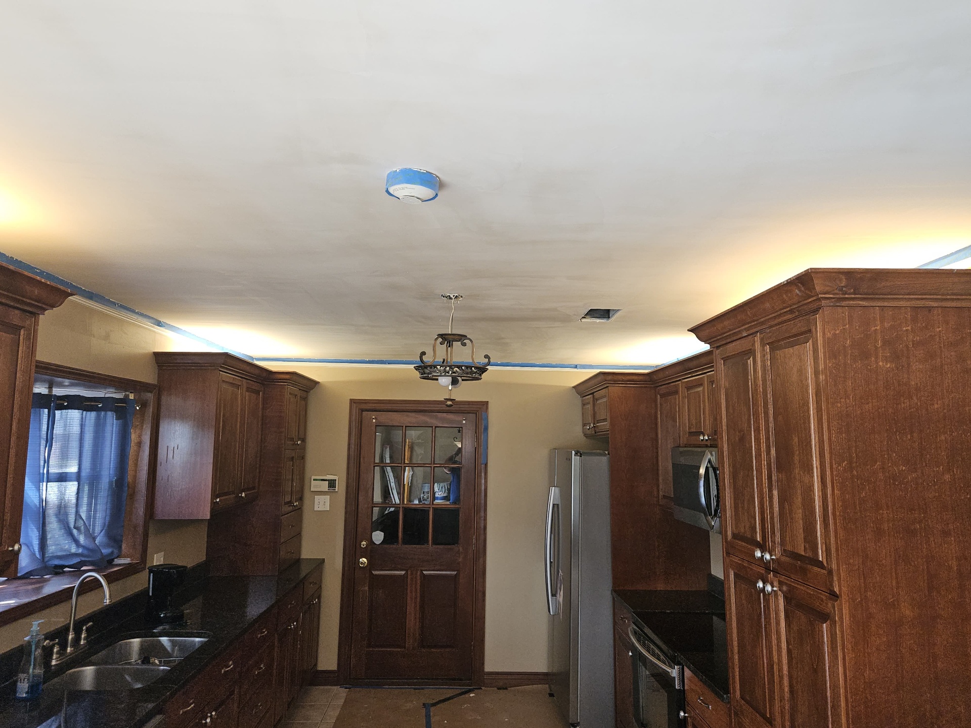 Primed smooth kitchen ceiling ready for final paint